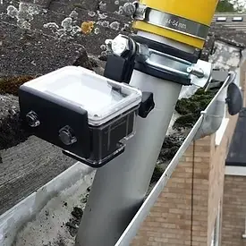 Roof cleaning Leicester experts applying treatment to prevent moss regrowth on roof tiles