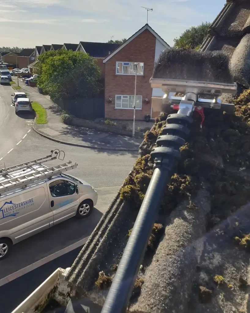 Roof cleaning Leicester by a professional roof cleaning company removing moss from tiled roof